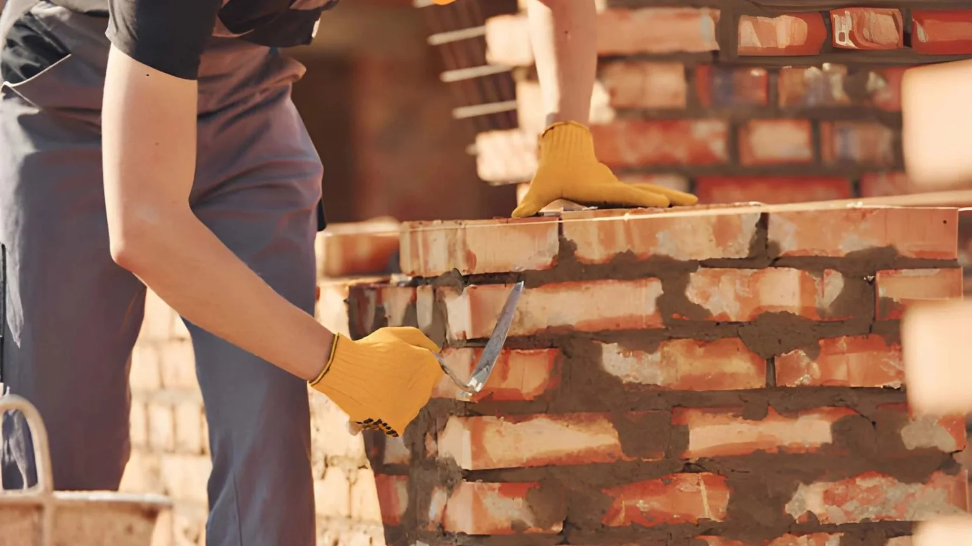 Masonry repair contractor working on Queens residential building
